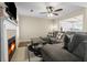 Cozy living room with fireplace, tile surround, and view into the kitchen at 19 Rudwick Cir, Goose Creek, SC 29445