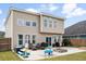 Spacious backyard with patio, fire pit, outdoor seating, grill and play structures, perfect for entertaining at 200 Topsaw Ln, Moncks Corner, SC 29461