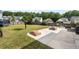 Fenced in backyard with green grass, hardscaped patio with seating, firepit, trampoline and playground at 200 Topsaw Ln, Moncks Corner, SC 29461