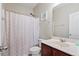 This bathroom has a shower and tub combination and sink with vanity with modern fixtures at 200 Topsaw Ln, Moncks Corner, SC 29461
