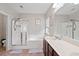 Large bathroom with a soaking tub, glass shower, double vanity and neutral tile floors at 200 Topsaw Ln, Moncks Corner, SC 29461