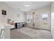 Upstairs bonus room with neutral paint, carpet, natural light, and decorative touches at 200 Topsaw Ln, Moncks Corner, SC 29461