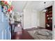 Open-concept entryway with hardwood floors, elegant decor, and seamless transition to the spacious living area at 200 Topsaw Ln, Moncks Corner, SC 29461
