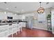 Modern kitchen featuring white cabinets, granite countertops, stainless steel appliances, and a breakfast bar at 200 Topsaw Ln, Moncks Corner, SC 29461