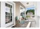 Inviting covered porch with rocking chairs, offering a relaxing outdoor space with views at 200 Topsaw Ln, Moncks Corner, SC 29461
