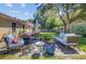 Backyard with patio featuring fire pit, lounge furniture, and mature landscaping at 2076 Presidio Dr, Mount Pleasant, SC 29466
