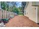 Home exterior with fenced-in backyard featuring storage and landscaping at 2076 Presidio Dr, Mount Pleasant, SC 29466