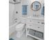 Bathroom featuring a shower-tub combo, a marble vanity, and stylish towel storage at 2076 Presidio Dr, Mount Pleasant, SC 29466