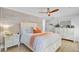 Bright bedroom with a queen size bed, ceiling fan, and a white dresser at 2076 Presidio Dr, Mount Pleasant, SC 29466