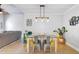 Open-concept dining area with view to living room, modern light fixture and a colorful decor at 2076 Presidio Dr, Mount Pleasant, SC 29466