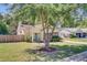 Exterior view of the home with a tree in the yard and a light blue front door at 2076 Presidio Dr, Mount Pleasant, SC 29466