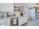 An airy kitchen with granite countertops, stainless appliances, and a sliding barn door at 2076 Presidio Dr, Mount Pleasant, SC 29466