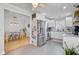 Open kitchen area with stainless steel appliances, white cabinets, and adjacent dining space at 2076 Presidio Dr, Mount Pleasant, SC 29466