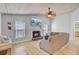 Spacious living room with vaulted ceilings, fireplace, and a comfortable sectional sofa provides a relaxing space at 2076 Presidio Dr, Mount Pleasant, SC 29466