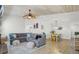 Open-concept living space with a sectional sofa, dining area, and stylish decor offers ample space for entertaining at 2076 Presidio Dr, Mount Pleasant, SC 29466