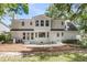 Back exterior featuring the white siding, bay window, patio, and landscaping at 220 Runnymede Ln, Summerville, SC 29485