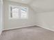 Empty bedroom with neutral walls, carpet flooring, and natural light at 220 Runnymede Ln, Summerville, SC 29485