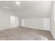 Large bonus room with carpet and neutral walls, doors to additional rooms and storage at 220 Runnymede Ln, Summerville, SC 29485