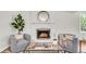 Inviting living room with a charming fireplace, cozy seating, and decorative accents for a warm atmosphere at 220 Runnymede Ln, Summerville, SC 29485