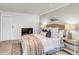 Relaxing main bedroom with a fireplace, shiplap wall, and soft color palette at 220 Runnymede Ln, Summerville, SC 29485