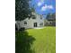 A spacious backyard featuring a patio and lush green grass, perfect for entertaining at 308 Tidal Rice Ct, Wando, SC 29492