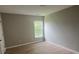 Cozy bedroom with a large window that offers ample natural light and hardwood floors at 308 Tidal Rice Ct, Wando, SC 29492