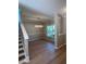 Well-lit dining room with a modern chandelier and beautiful hardwood floors at 308 Tidal Rice Ct, Wando, SC 29492