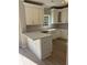 Well-lit kitchen with white cabinets, quartz countertops, and stainless steel appliances at 308 Tidal Rice Ct, Wando, SC 29492
