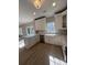 Spacious kitchen featuring a large island, stainless appliances, and a farmhouse sink at 308 Tidal Rice Ct, Wando, SC 29492