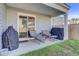Comfortable covered back porch with seating and outdoor grills perfect for relaxing at 325 Coral Sunset Way, Summerville, SC 29486