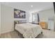 Cozy bedroom features large world art, soft carpet, and modern furnishings at 325 Coral Sunset Way, Summerville, SC 29486
