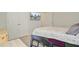 Bedroom with floral bedding, wall-mounted TV, and abundant closet space at 325 Coral Sunset Way, Summerville, SC 29486