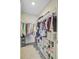 Walk-in closet features built-in shelving and ample hanging storage for organization at 325 Coral Sunset Way, Summerville, SC 29486