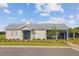 Attractive community clubhouse features a modern design with a metal roof and a well-kept lawn at 325 Coral Sunset Way, Summerville, SC 29486