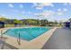 Large community pool with plenty of lounge chairs, palm trees and clear, refreshing water at 325 Coral Sunset Way, Summerville, SC 29486
