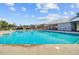 Beautiful community pool featuring fountains, surrounding lounge chairs, and a pool-side covered area at 325 Coral Sunset Way, Summerville, SC 29486