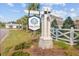 Welcoming Shell Pointe at Cobblestone Village community sign with flowers and greenery at 325 Coral Sunset Way, Summerville, SC 29486