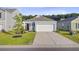 Attractive single-Gathering home featuring a two-car garage, neat landscaping, and inviting curb appeal at 325 Coral Sunset Way, Summerville, SC 29486