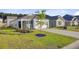 Well-maintained home with a two-car garage, green lawn, and young tree in a Gathering-friendly neighborhood at 325 Coral Sunset Way, Summerville, SC 29486