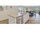 Kitchen island featuring stainless steel dishwasher, countertops, sink, and open views of the dining area at 325 Coral Sunset Way, Summerville, SC 29486