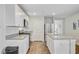 Bright kitchen featuring white cabinetry, stainless steel appliances, and an island with countertop seating at 325 Coral Sunset Way, Summerville, SC 29486