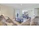 Cozy living room features plush seating, a large TV, and access to the outdoor space, perfect for relaxation at 325 Coral Sunset Way, Summerville, SC 29486