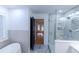 Bright bathroom with double vanity, glass shower, freestanding tub, and natural light at 3385 Wayland Dr, Ladson, SC 29456