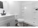Bathroom featuring a modern vanity, toilet, and walk-in shower with built-in shelving at 3385 Wayland Dr, Ladson, SC 29456