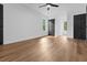 Bright bedroom featuring hardwood floors, white walls, and black doors and trim at 3385 Wayland Dr, Ladson, SC 29456