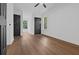 Spacious bedroom with neutral walls, hardwood floors, and natural light from windows at 3385 Wayland Dr, Ladson, SC 29456