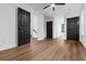 Large bedroom with black doors, hardwood floors, and white walls at 3385 Wayland Dr, Ladson, SC 29456