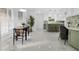 Open floor plan with dining area leading to kitchen with island and green cabinets at 3385 Wayland Dr, Ladson, SC 29456