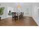 Bright dining room with hardwood floors, large windows, and a view of the kitchen at 3385 Wayland Dr, Ladson, SC 29456