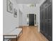 Bright and airy foyer featuring hardwood floors, modern decor, and ample natural light at 3385 Wayland Dr, Ladson, SC 29456